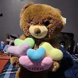 Cuddly Brown Teddy Bear with Colorful Hearts